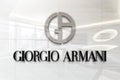 Giorgio armani on glossy office wall realistic texture